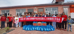 民进省委常委马海龙端午节为小河里岛村民送温
